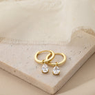 Hinged Hoop with White Cubic Zirconia Teardrop Earrings earrings stock